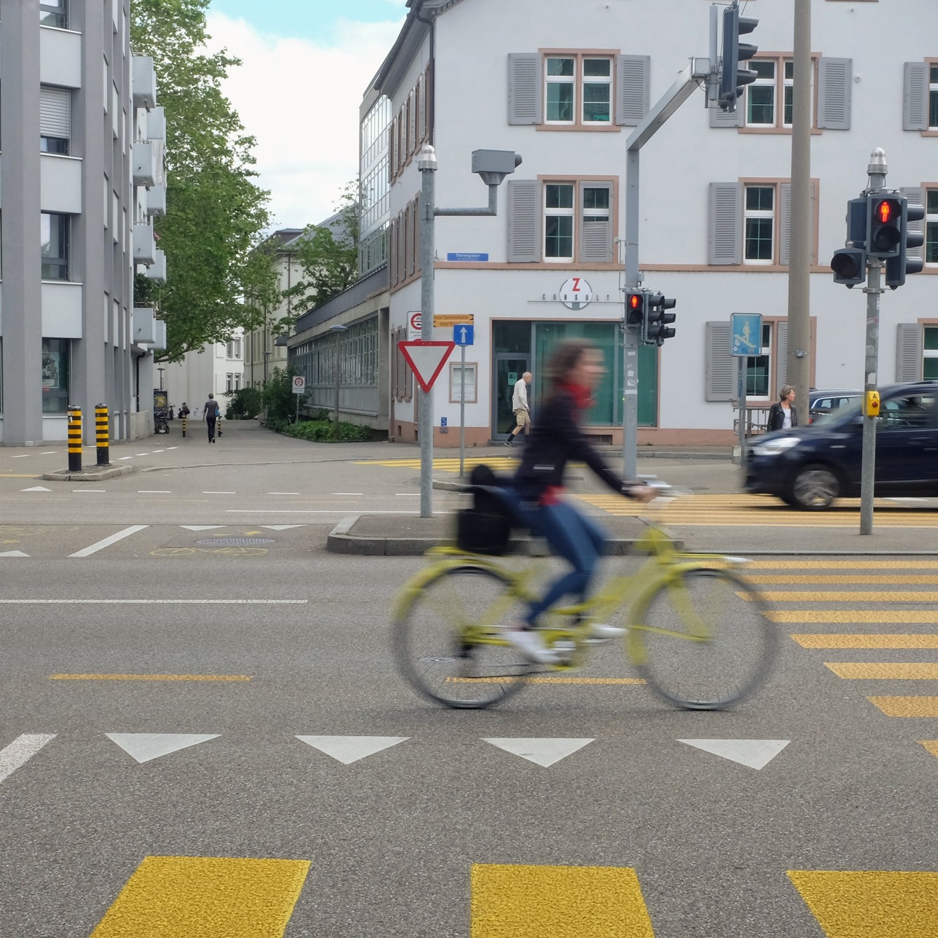 Photo of a street with a cyclist